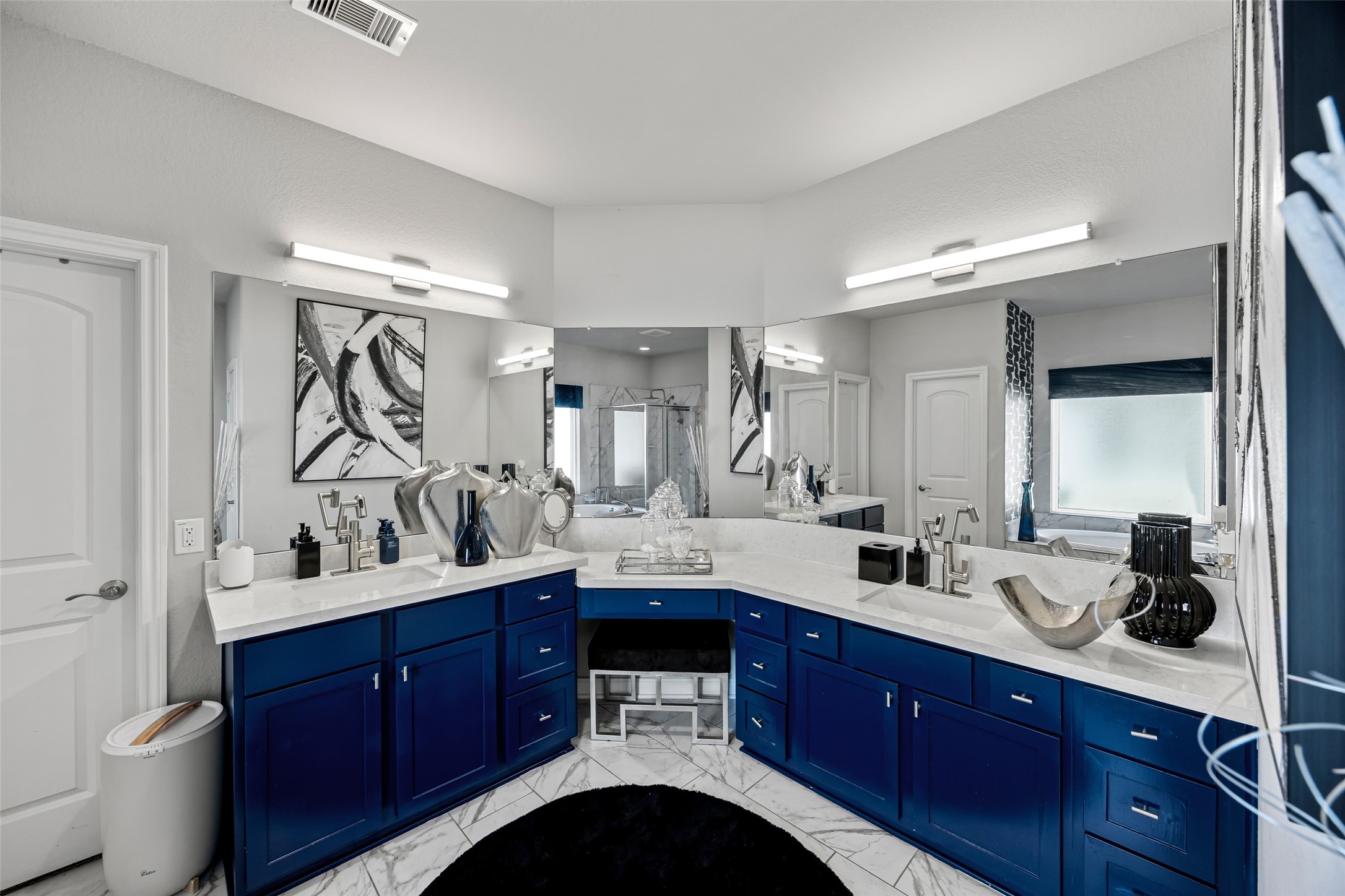2823 Skerne Forest Drive Spring, TX 77373 - Photo 23 of 43 a bathroom with a double vanity sink and a mirror