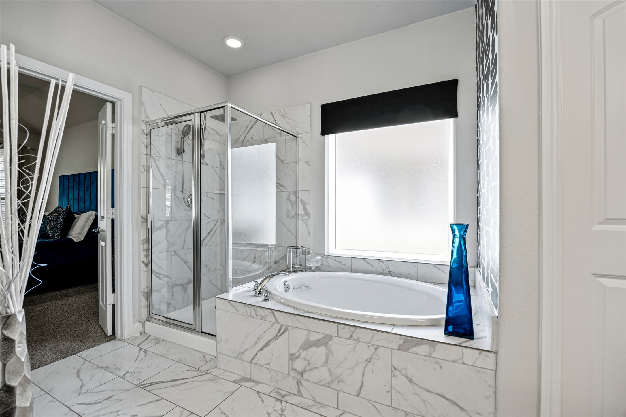 2823 Skerne Forest Drive Spring, TX 77373 - Photo 24 of 43 a bathroom with a tub and a shower