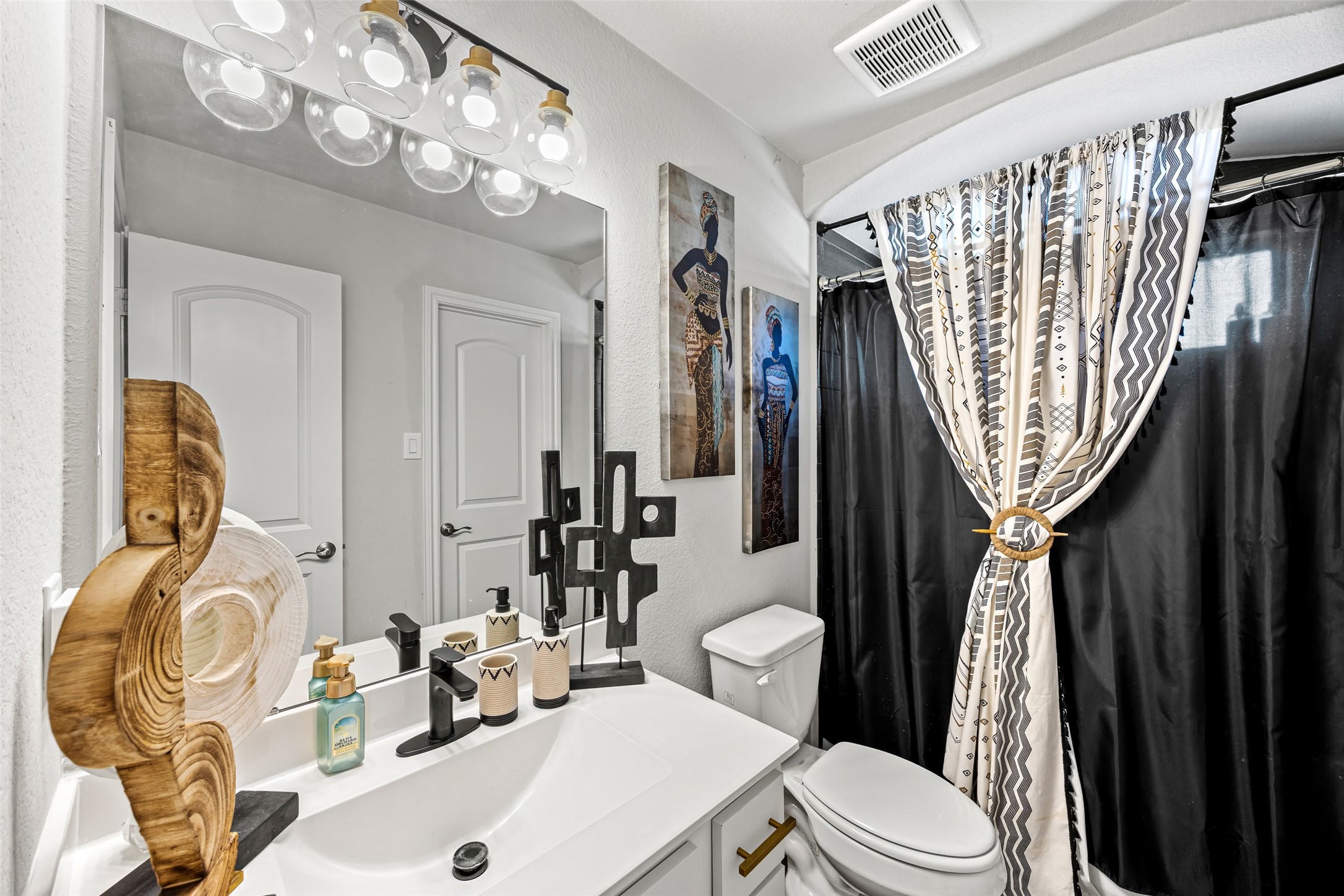 2823 Skerne Forest Drive Spring, TX 77373 - Photo 35 of 43 a bathroom with a sink a toilet and mirror