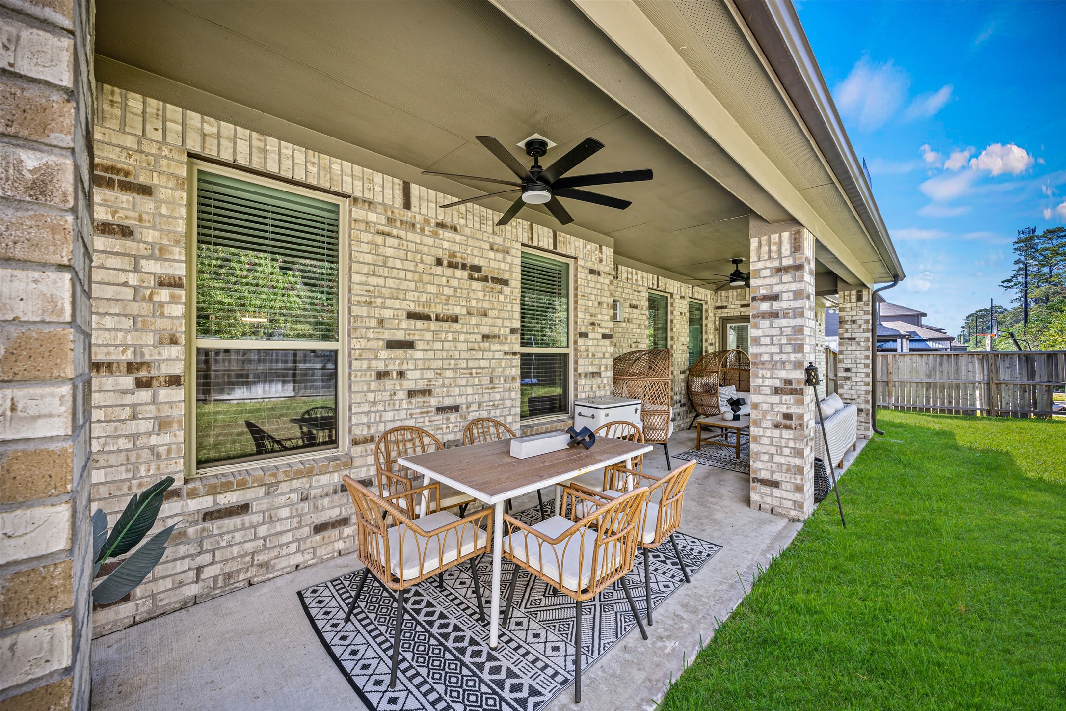 2823 Skerne Forest Drive Spring, TX 77373 - Photo 40 of 43 a view of a patio with a table and chairs