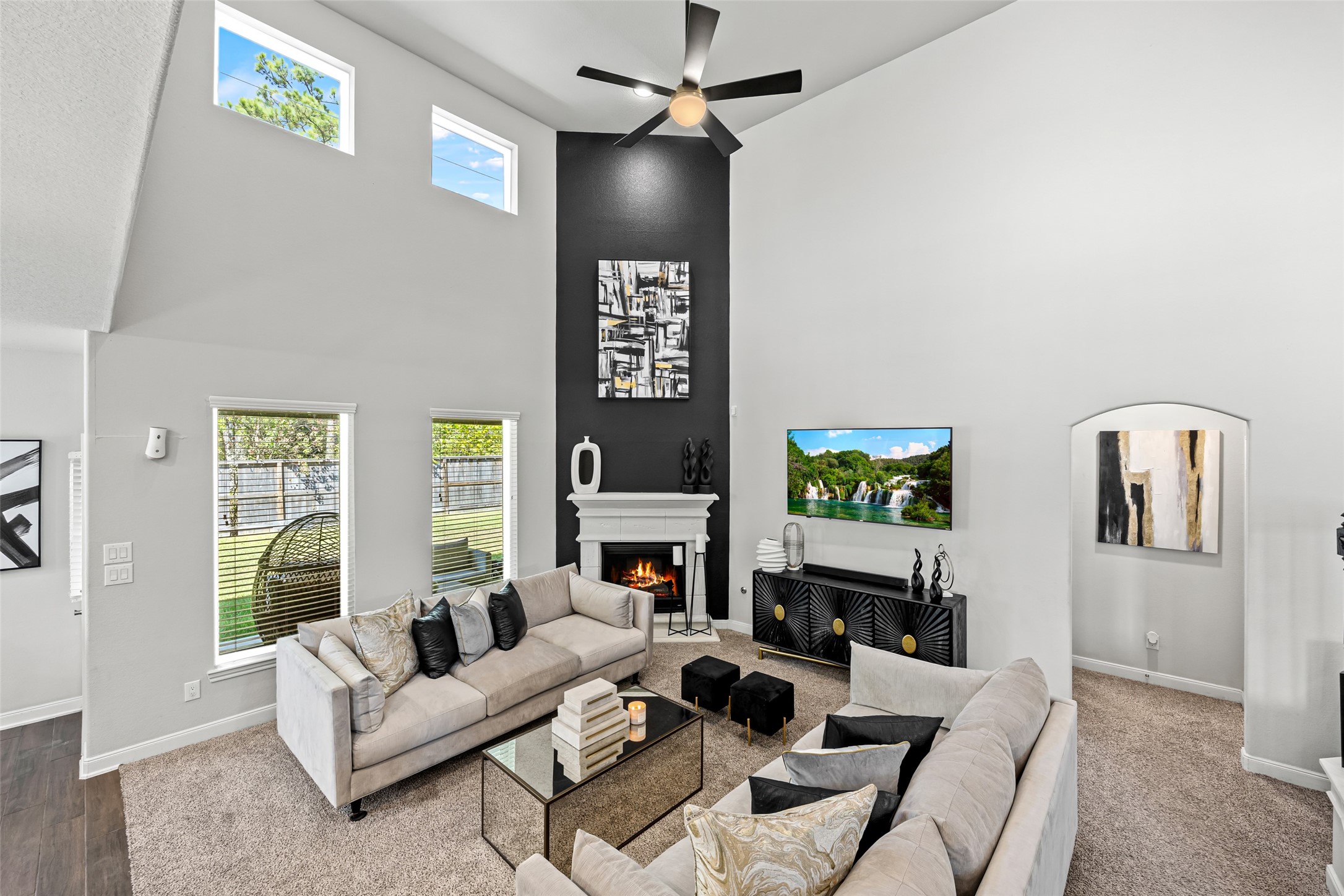 2823 Skerne Forest Drive Spring, TX 77373 - Photo 10 of 43 a living room with fireplace furniture and a flat screen tv