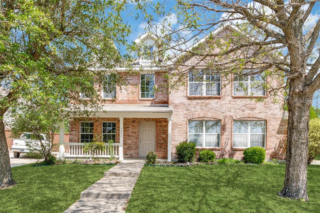 3846 Juniper Hills Drive Rockwall, TX 75032 - Photo 1 of 1 View of front of home with brick siding, a front lawn, and a porch