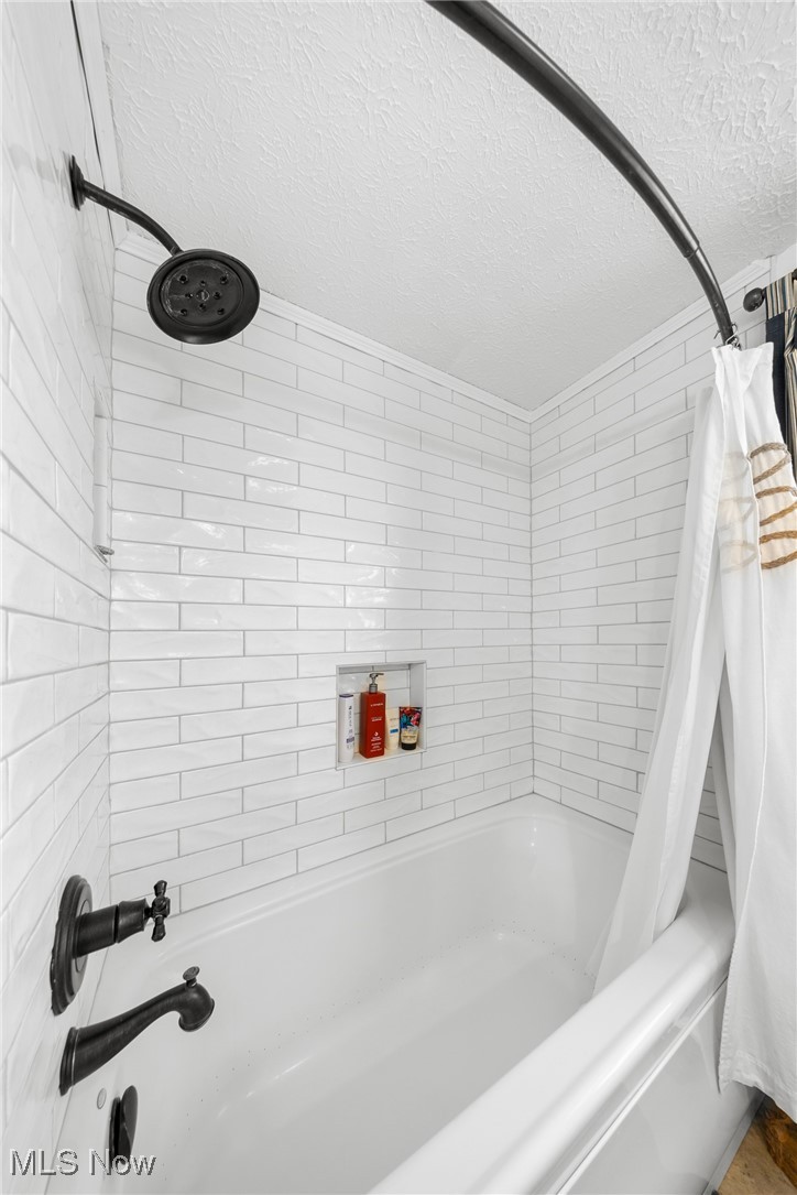 4515 State Road Medina, OH 44256 - Photo 23 of 36 Full bath featuring a textured ceiling and shower / bath combo
