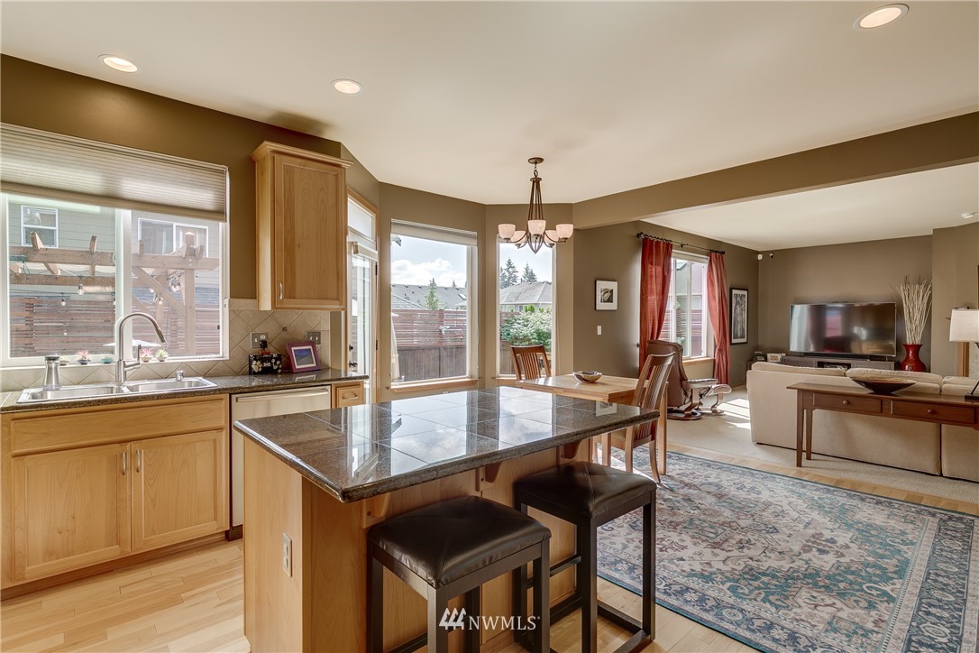 21105 1st Avenue West Bothell, WA 98021 - Photo 15 of 40 a large kitchen with a table and chairs in it
