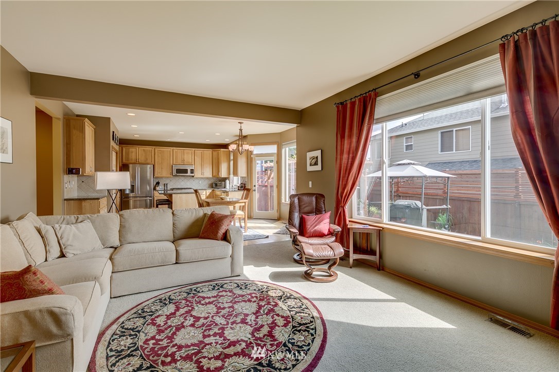 21105 1st Avenue West Bothell, WA 98021 - Photo 18 of 40 a living room with furniture a large window and a table