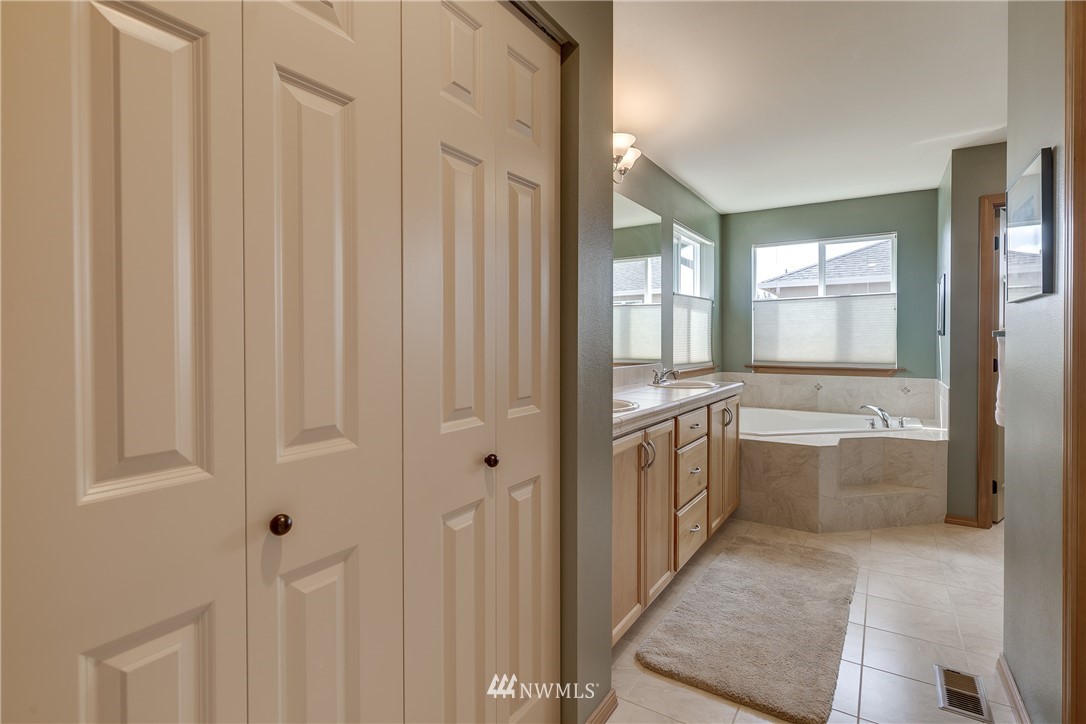 21105 1st Avenue West Bothell, WA 98021 - Photo 20 of 40 a bathroom with a sink a washer and dryer