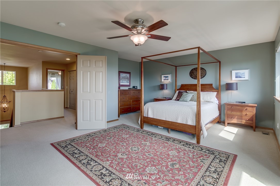 21105 1st Avenue West Bothell, WA 98021 - Photo 21 of 40 a bedroom with a large bed and a rug