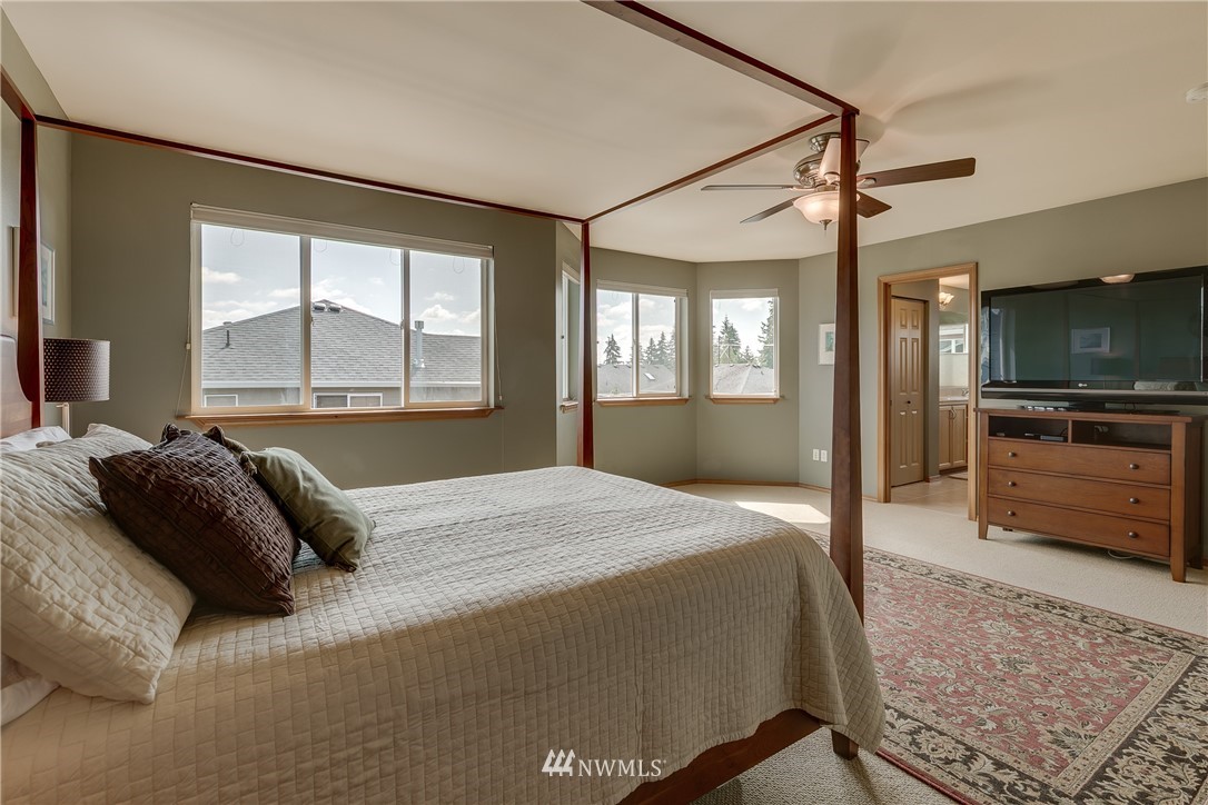 21105 1st Avenue West Bothell, WA 98021 - Photo 24 of 40 a bedroom with a bed and a television in it
