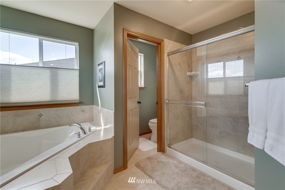21105 1st Avenue West Bothell, WA 98021 - Photo 26 of 40 a bathroom with a bathtub and a shower