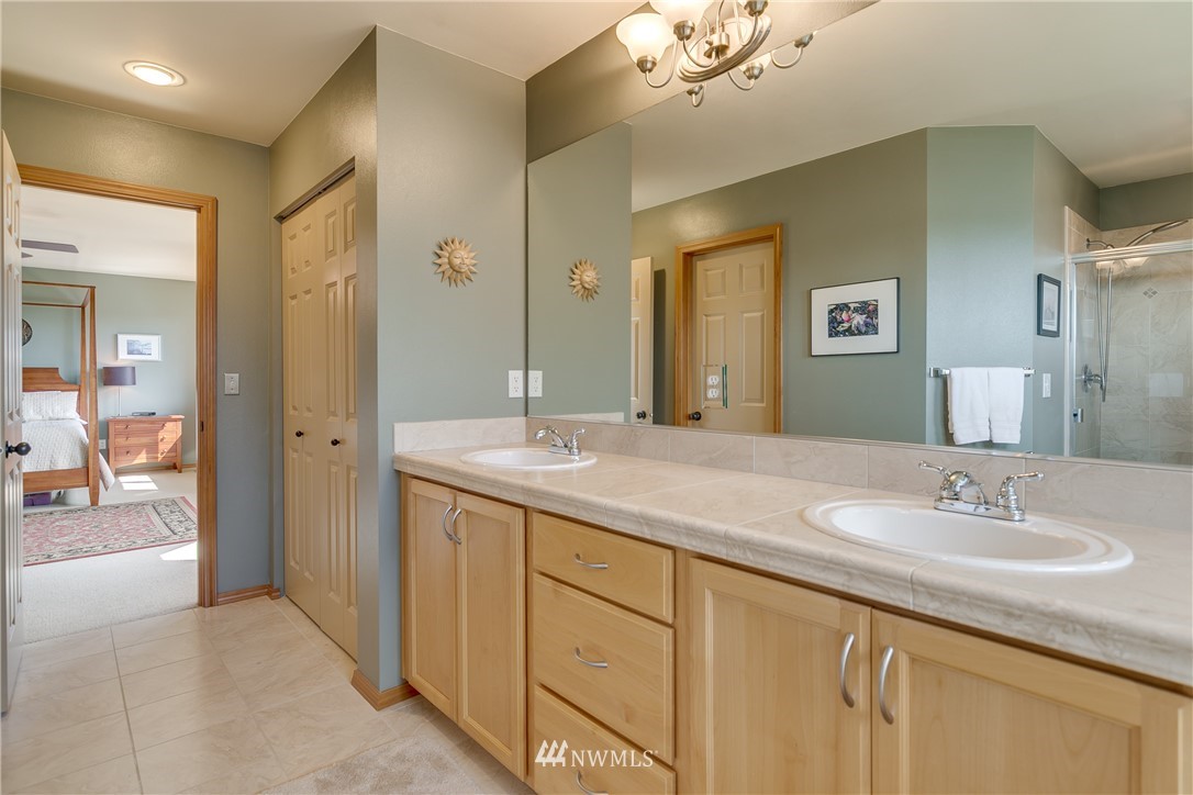 21105 1st Avenue West Bothell, WA 98021 - Photo 27 of 40 a bathroom with a sink double vanity and a mirror