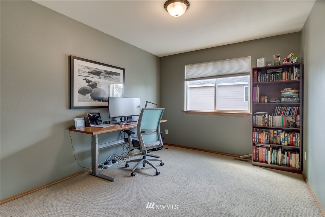 21105 1st Avenue West Bothell, WA 98021 - Photo 30 of 40 a view of a workspace with furniture and a bookshelf