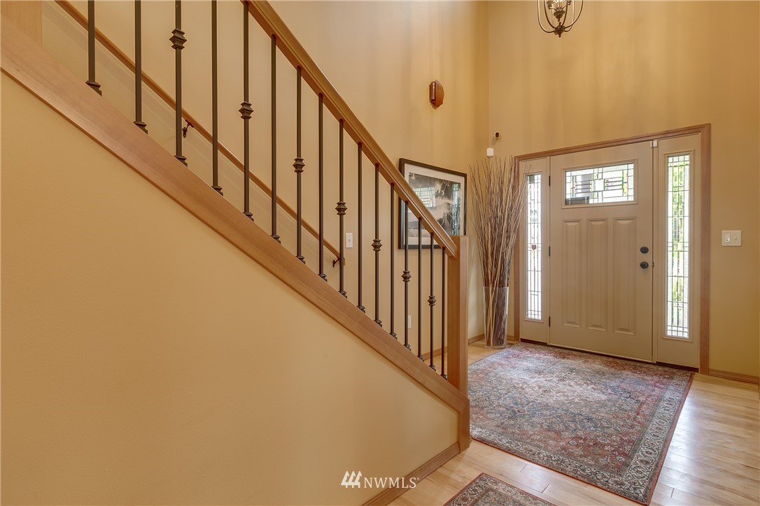 21105 1st Avenue West Bothell, WA 98021 - Photo 7 of 40 a view of an entryway with wooden floor