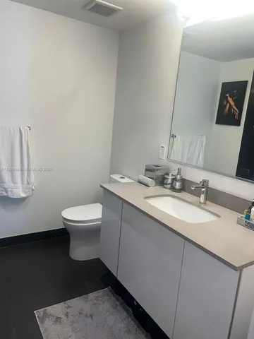 a kitchen with a stove a sink and a refrigerator