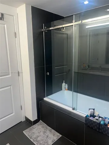 a bathroom with a sink toilet and mirror