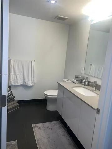 a kitchen with a sink and a stove top oven