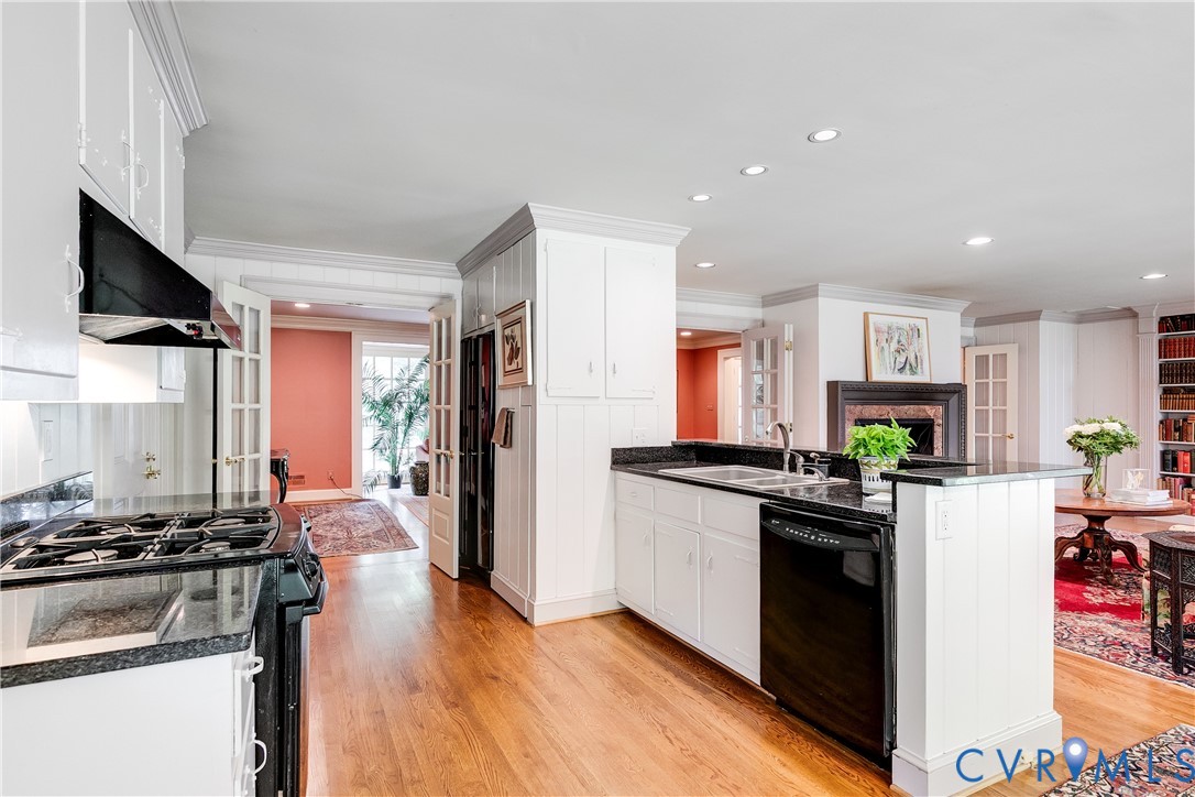 10475 Cherokee Road Richmond, VA 23235 - Photo 17 of 74 Kitchen featuring wood-finish flooring, white cabi