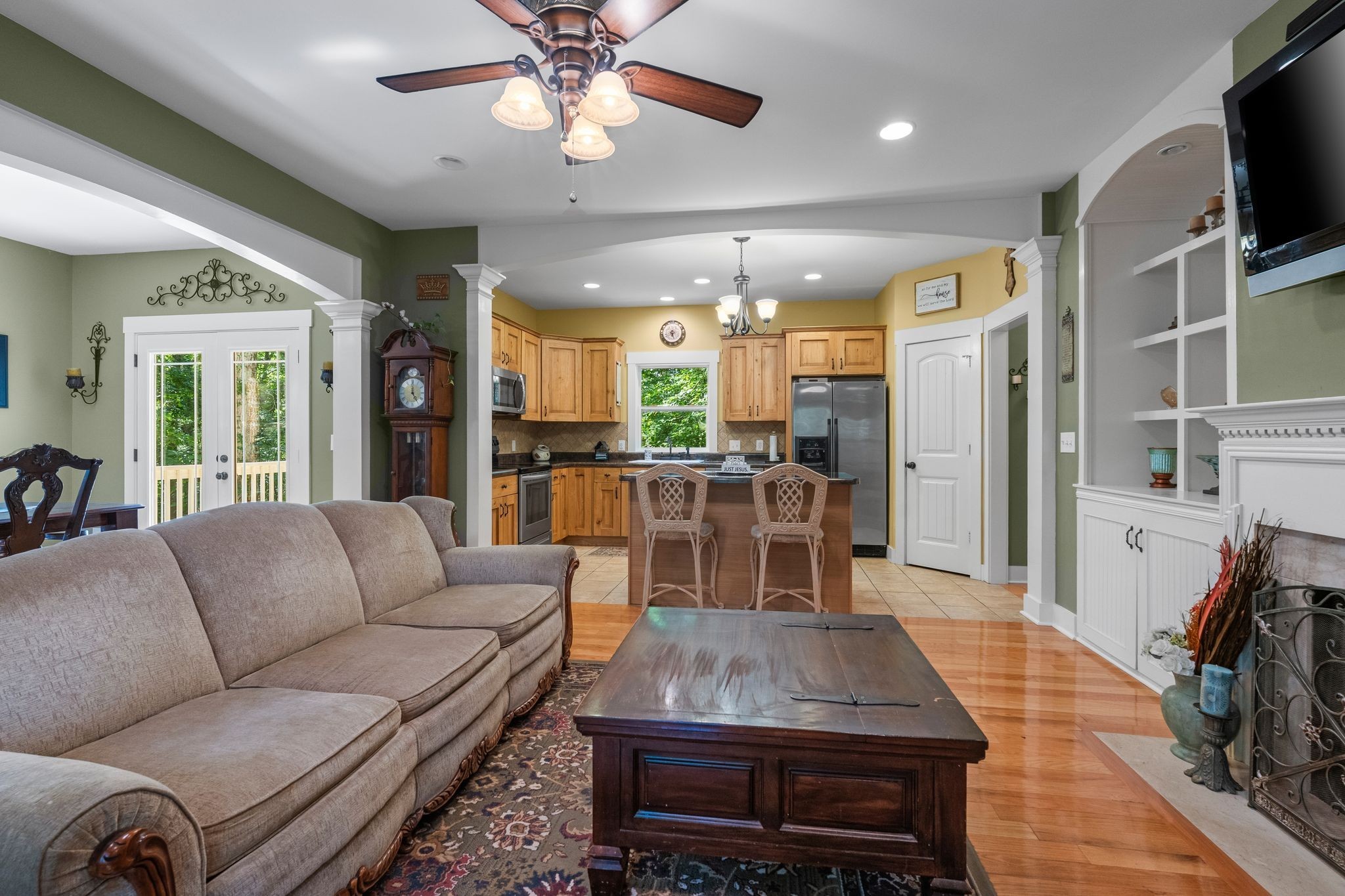 2504 Bearwallow Road Ashland City, TN 37015 - Photo 11 of 48 a living room with furniture a flat screen tv and a table