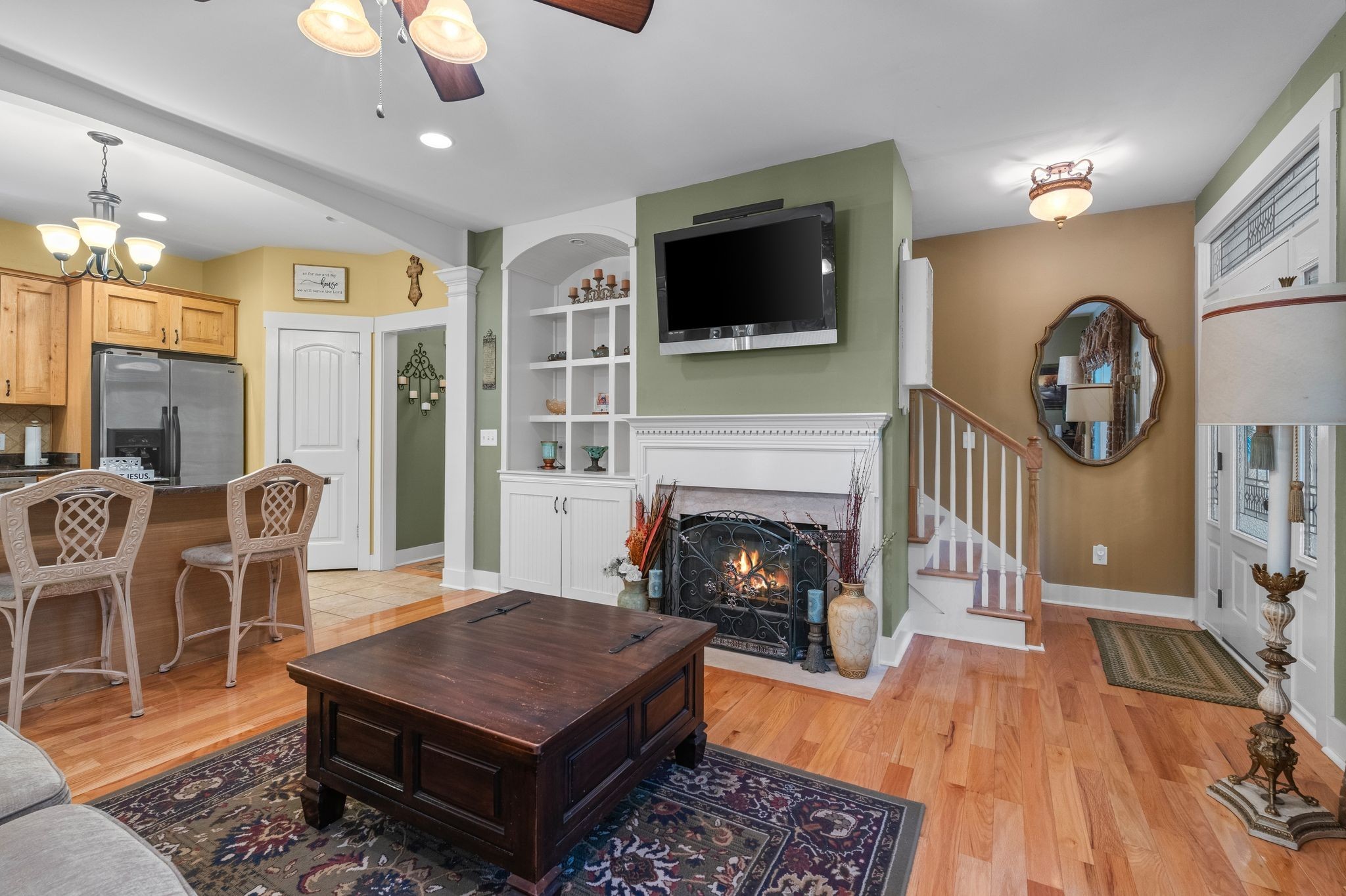 2504 Bearwallow Road Ashland City, TN 37015 - Photo 12 of 48 a living room with furniture a flat screen tv and a fireplace