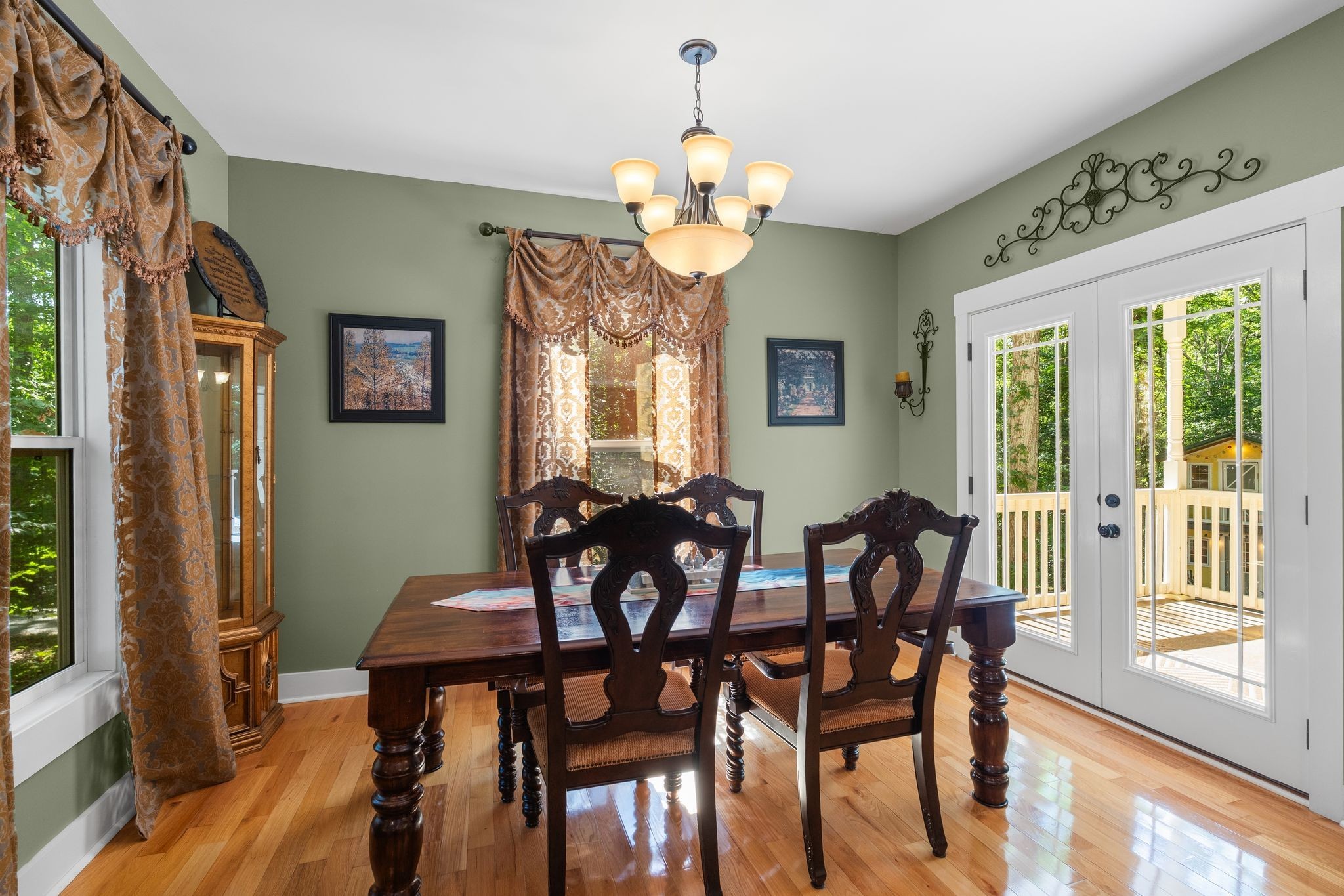 2504 Bearwallow Road Ashland City, TN 37015 - Photo 14 of 48 a view of a dining room with furniture a chandelier and wooden floor