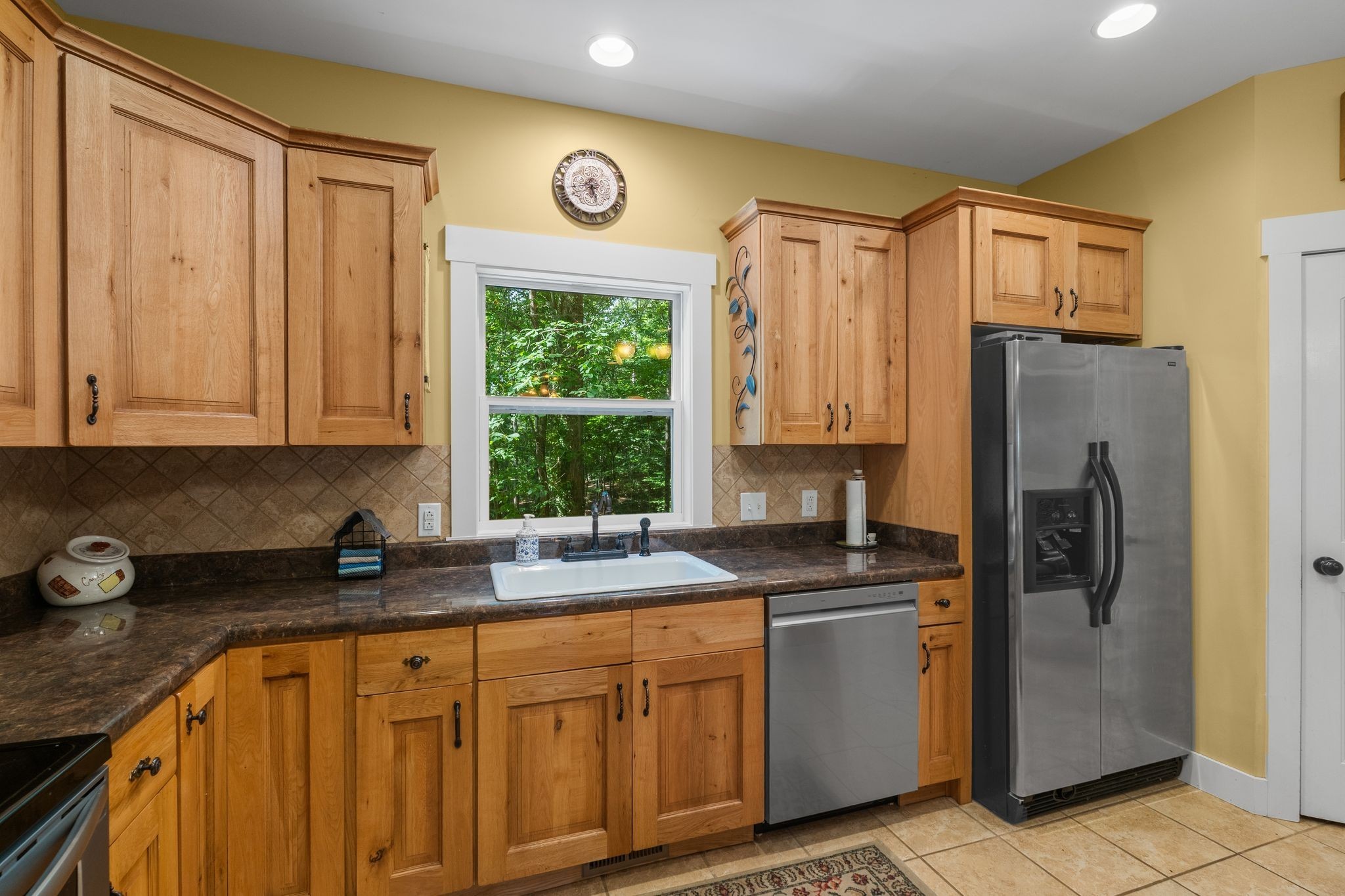 2504 Bearwallow Road Ashland City, TN 37015 - Photo 17 of 48 a kitchen with stainless steel appliances granite countertop a refrigerator sink and cabinets