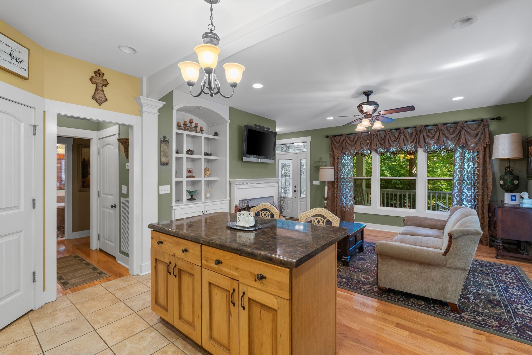 2504 Bearwallow Road Ashland City, TN 37015 - Photo 18 of 48 a view of a kitchen living space with furniture wooden floor and chandelier