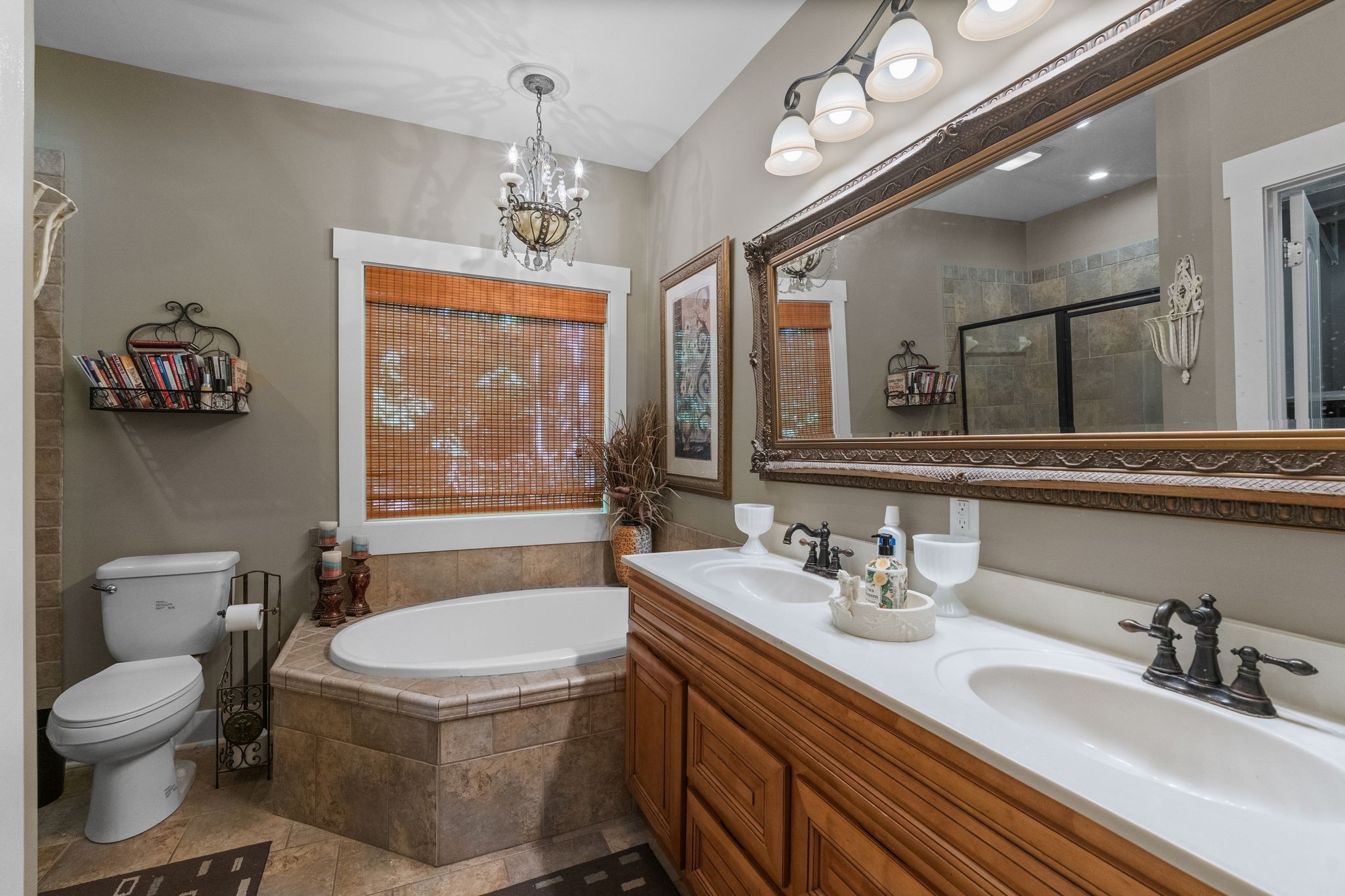2504 Bearwallow Road Ashland City, TN 37015 - Photo 22 of 48 a bathroom with a granite countertop toilet a sink and a mirror