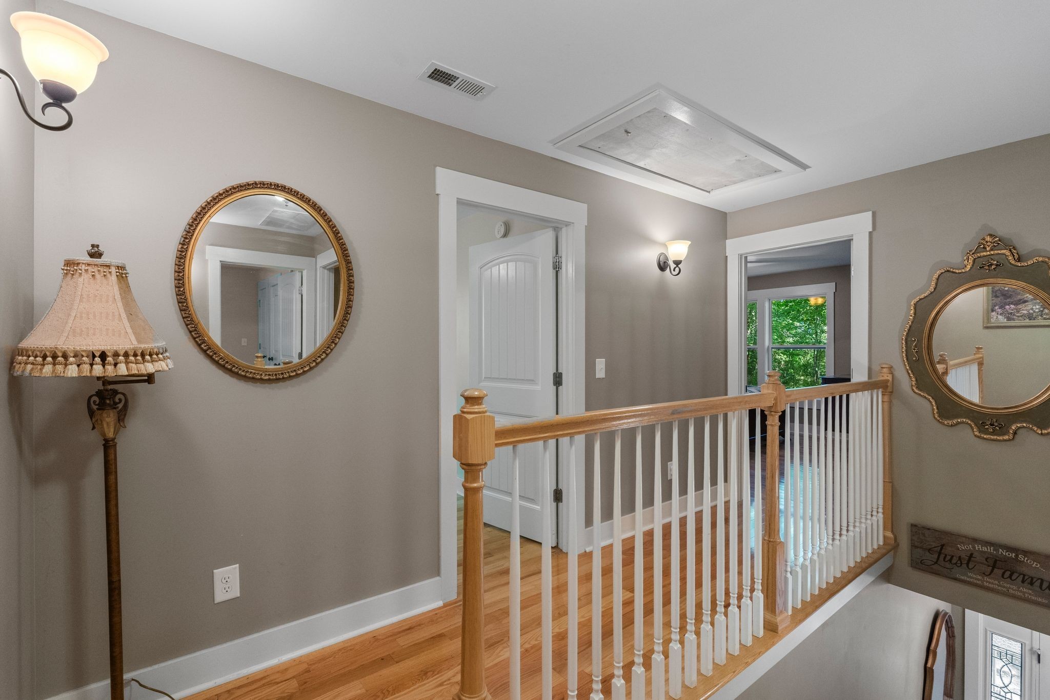 2504 Bearwallow Road Ashland City, TN 37015 - Photo 26 of 48 a view of a hallway with wooden floor and windows