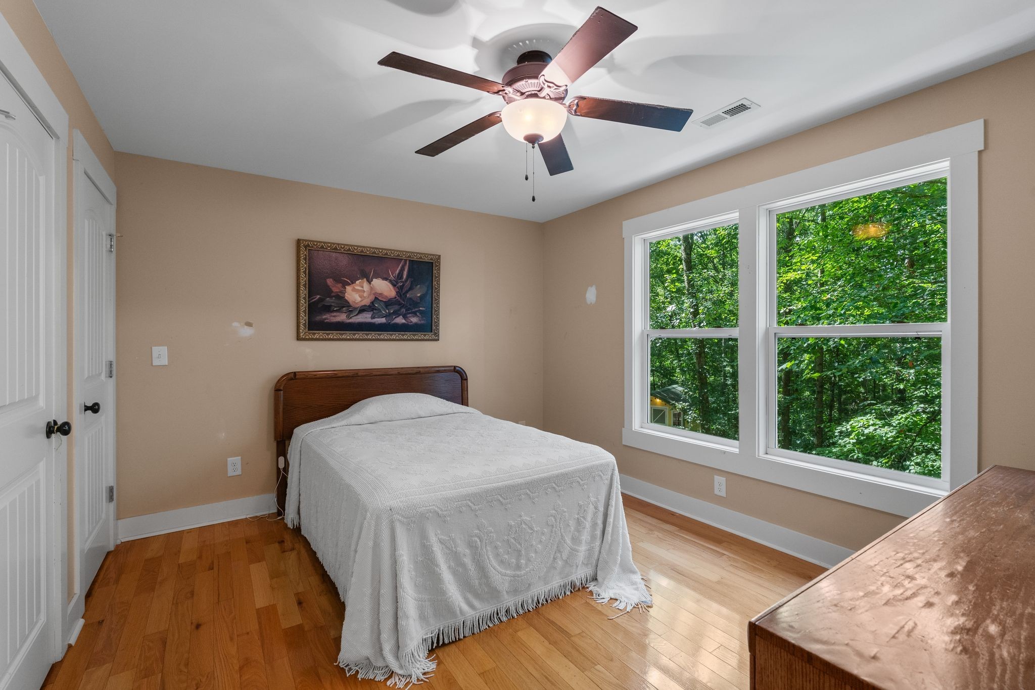 2504 Bearwallow Road Ashland City, TN 37015 - Photo 27 of 48 a bedroom with a large bed and a large window