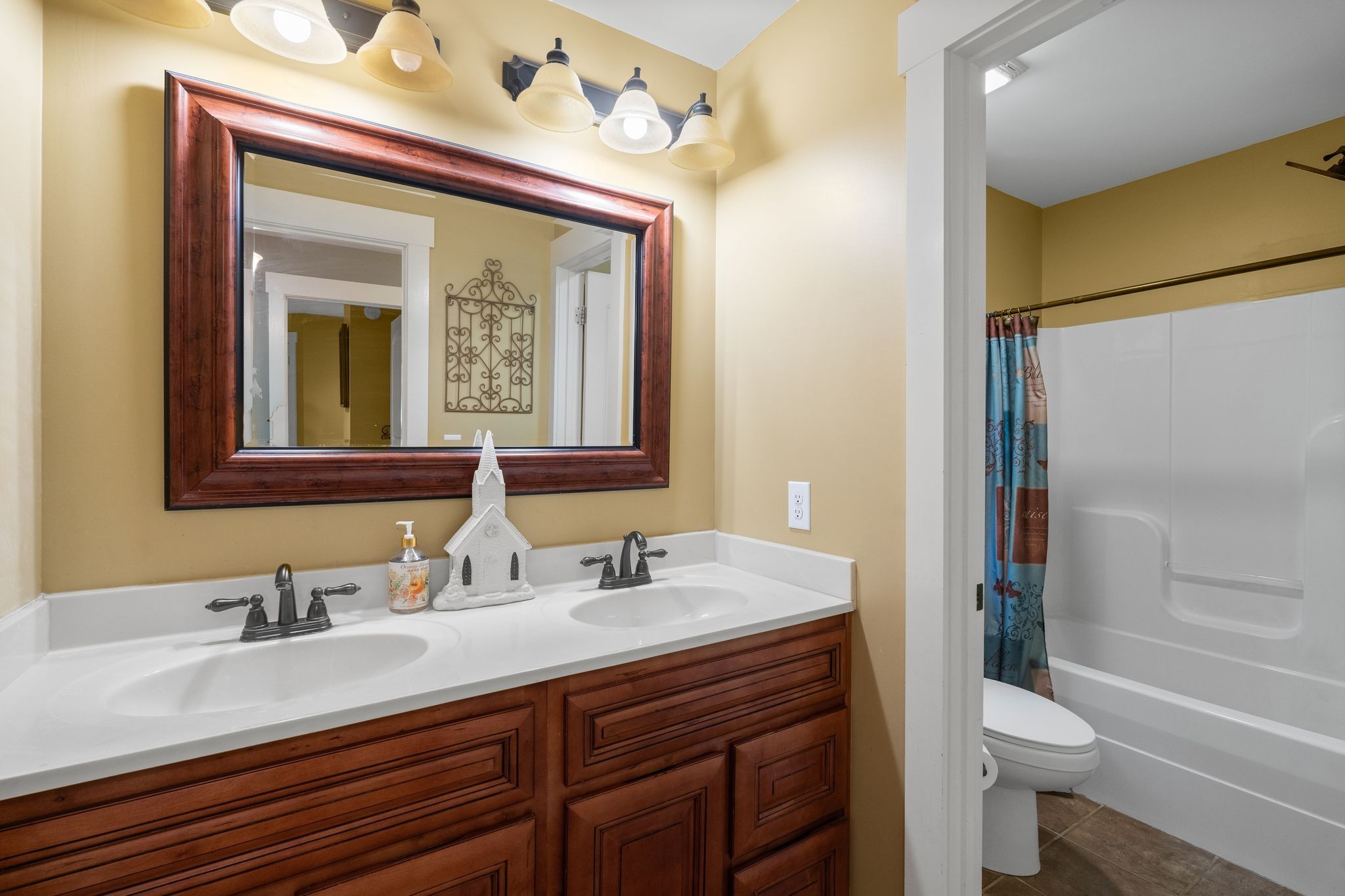 2504 Bearwallow Road Ashland City, TN 37015 - Photo 28 of 48 a bathroom with a sink vanity mirror and toilet