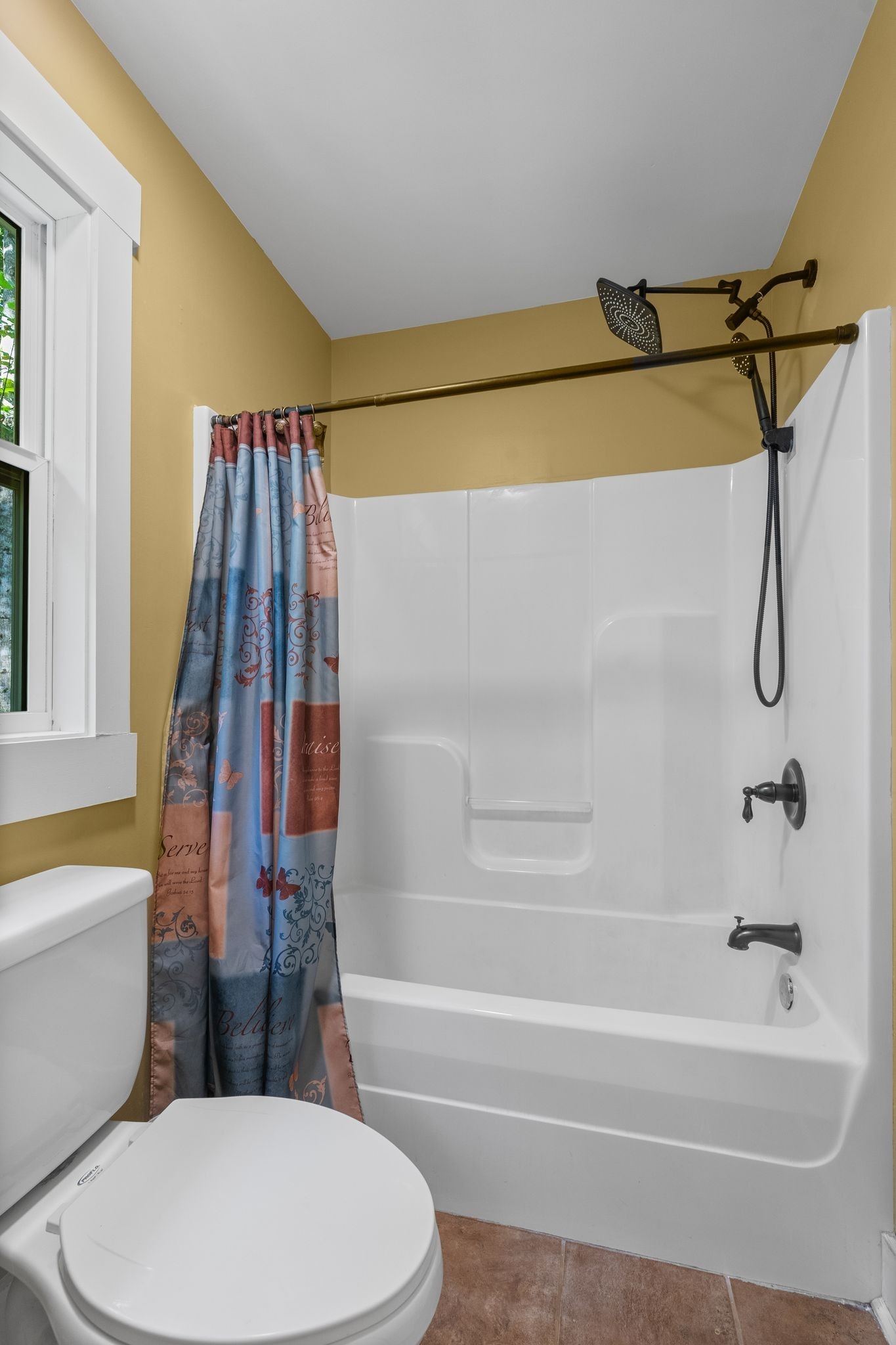 2504 Bearwallow Road Ashland City, TN 37015 - Photo 29 of 48 a bathroom with a toilet and a bathtub