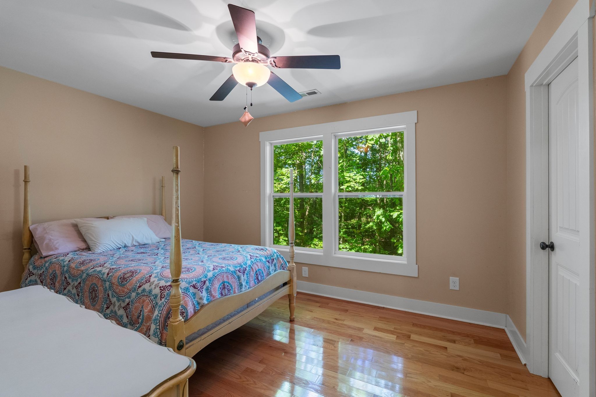 2504 Bearwallow Road Ashland City, TN 37015 - Photo 30 of 48 a bedroom with a large bed and a window