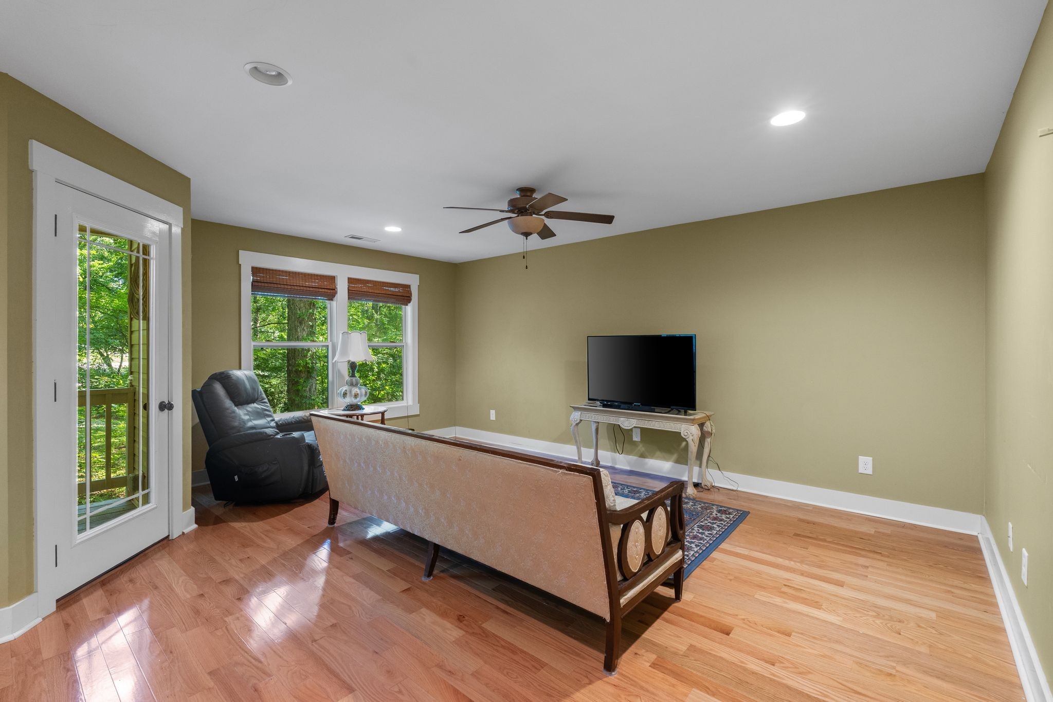 2504 Bearwallow Road Ashland City, TN 37015 - Photo 33 of 48 a living room with furniture and a flat screen tv