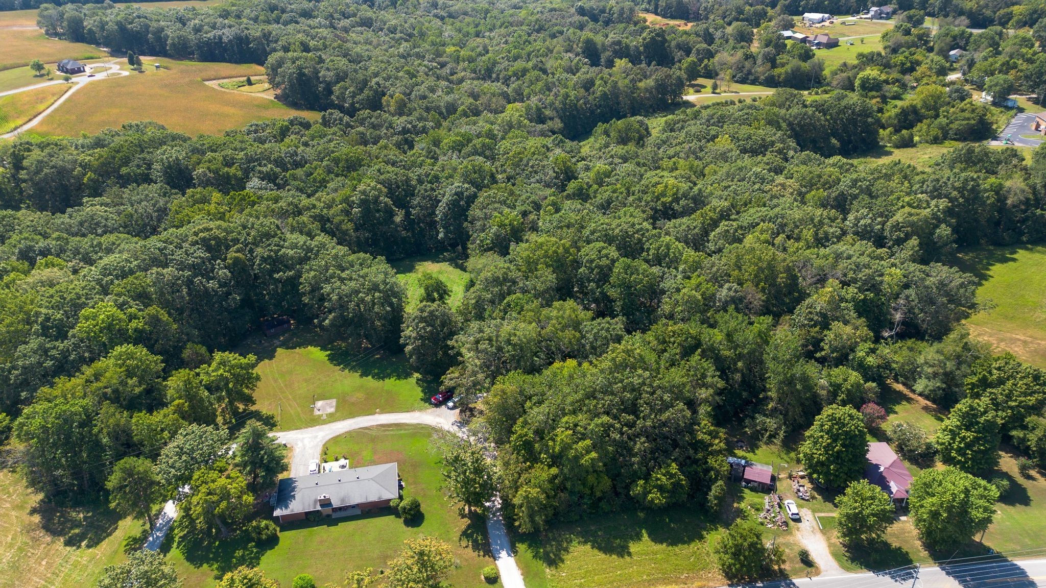 2504 Bearwallow Road Ashland City, TN 37015 - Photo 47 of 48 an aerial view of a house with a yard and lake view