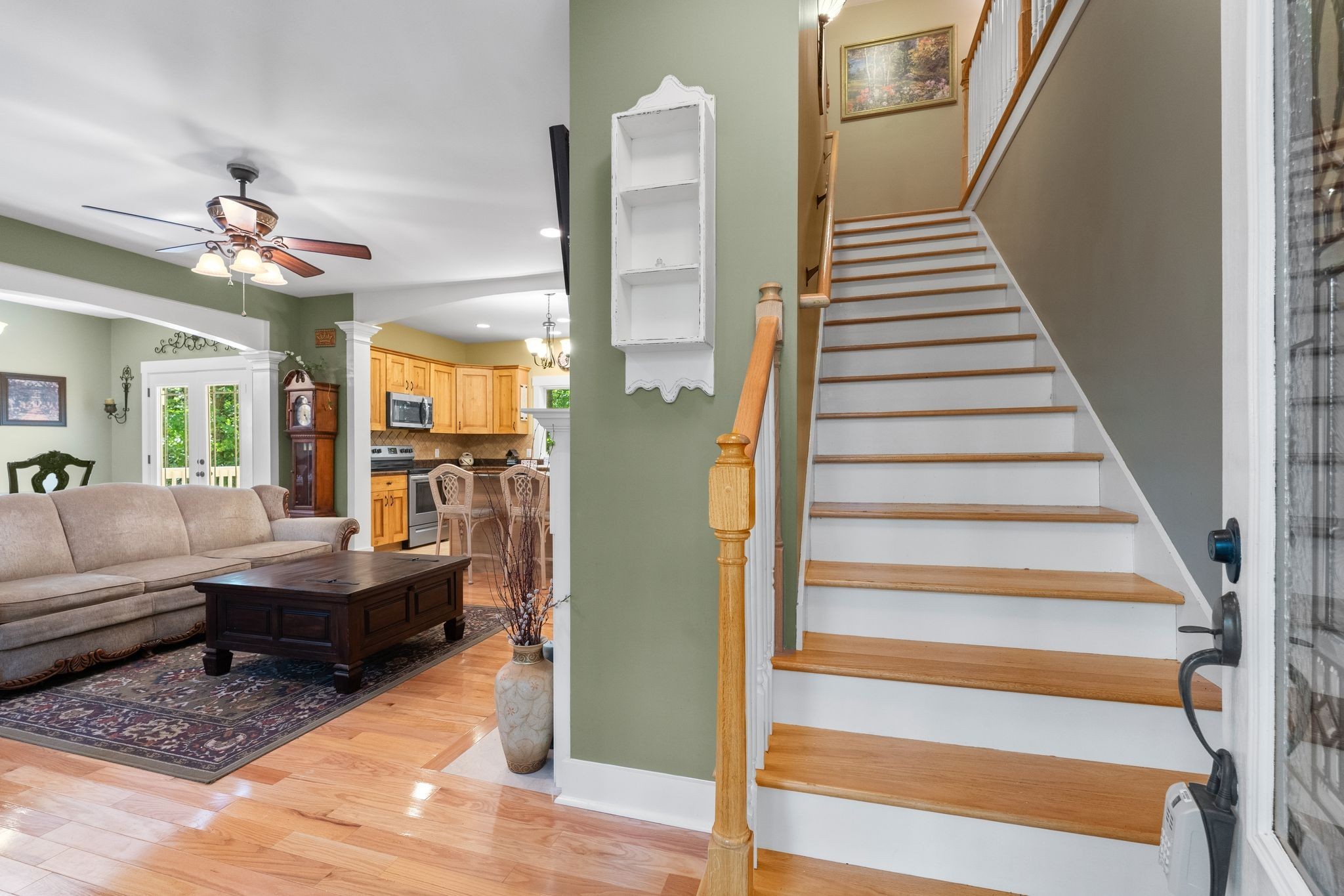 2504 Bearwallow Road Ashland City, TN 37015 - Photo 9 of 48 a living room with furniture and a chandelier