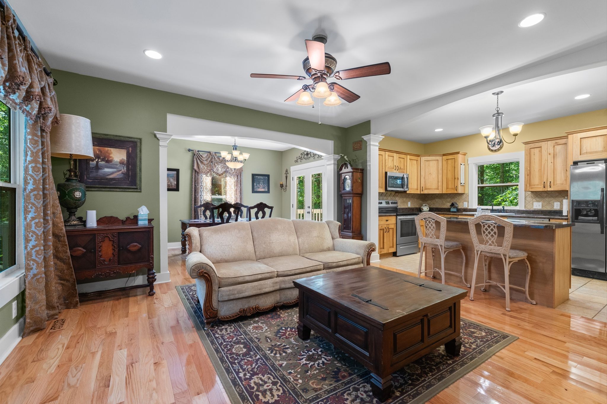 2504 Bearwallow Road Ashland City, TN 37015 - Photo 10 of 48 a living room with furniture kitchen view and a chandelier