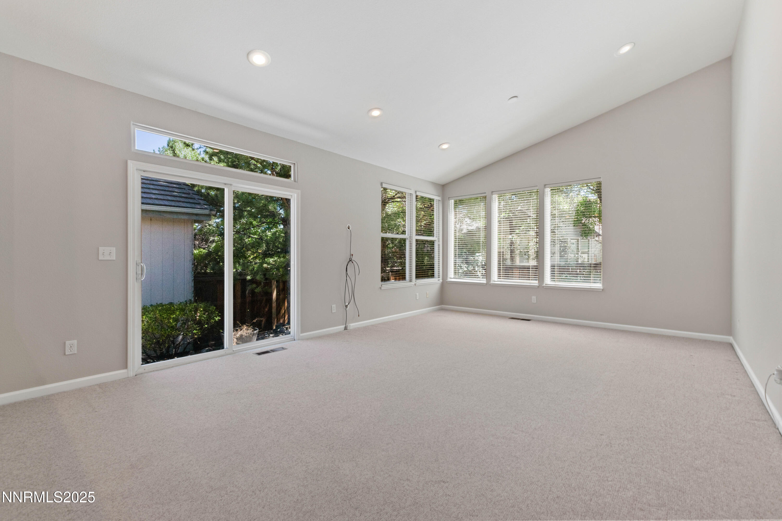 860 Caughlin Crossing Reno, NV 89519 - Photo 4 of 21 wooden floor and windows in an empty room