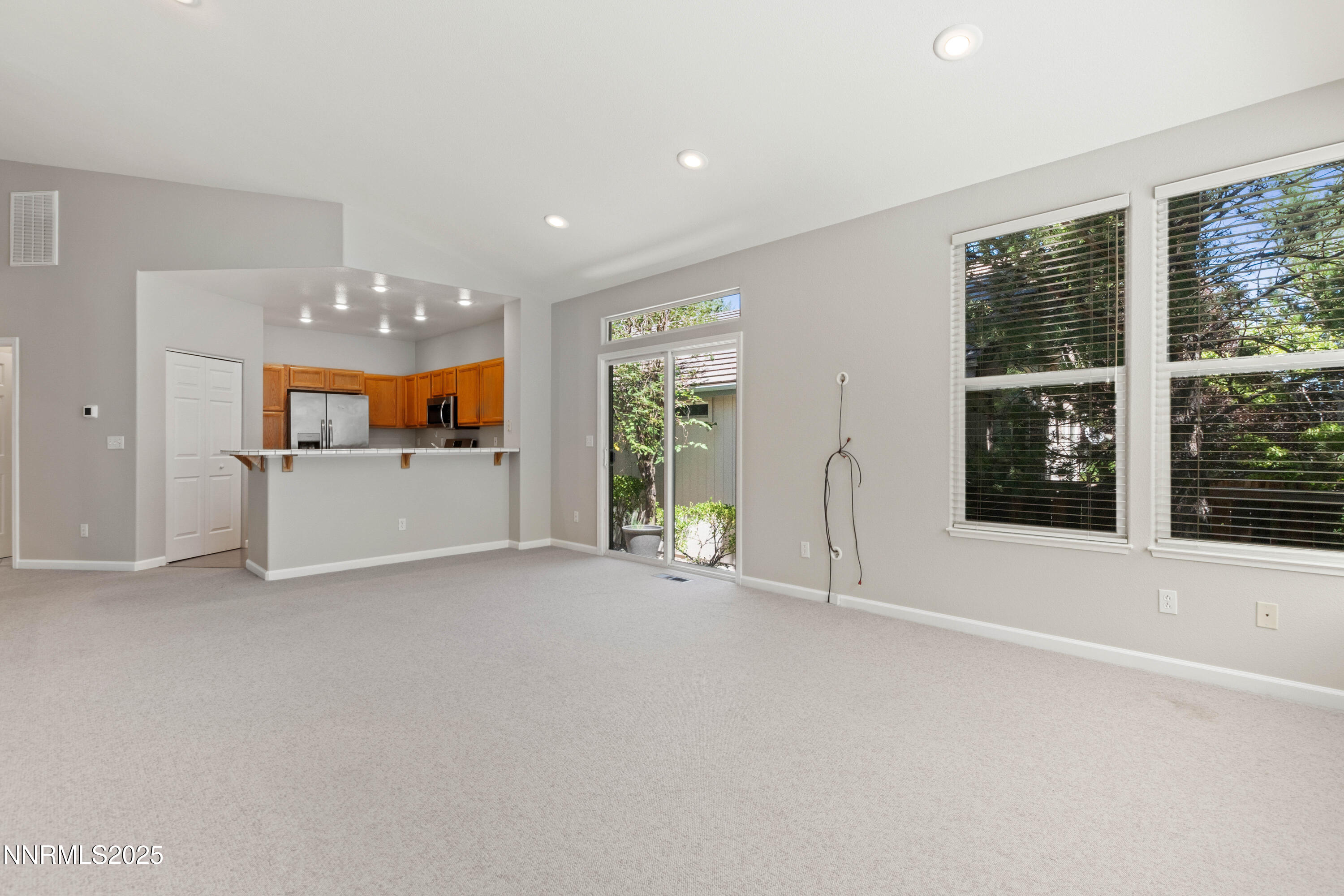 860 Caughlin Crossing Reno, NV 89519 - Photo 5 of 21 a view of a big room with windows and chandelier