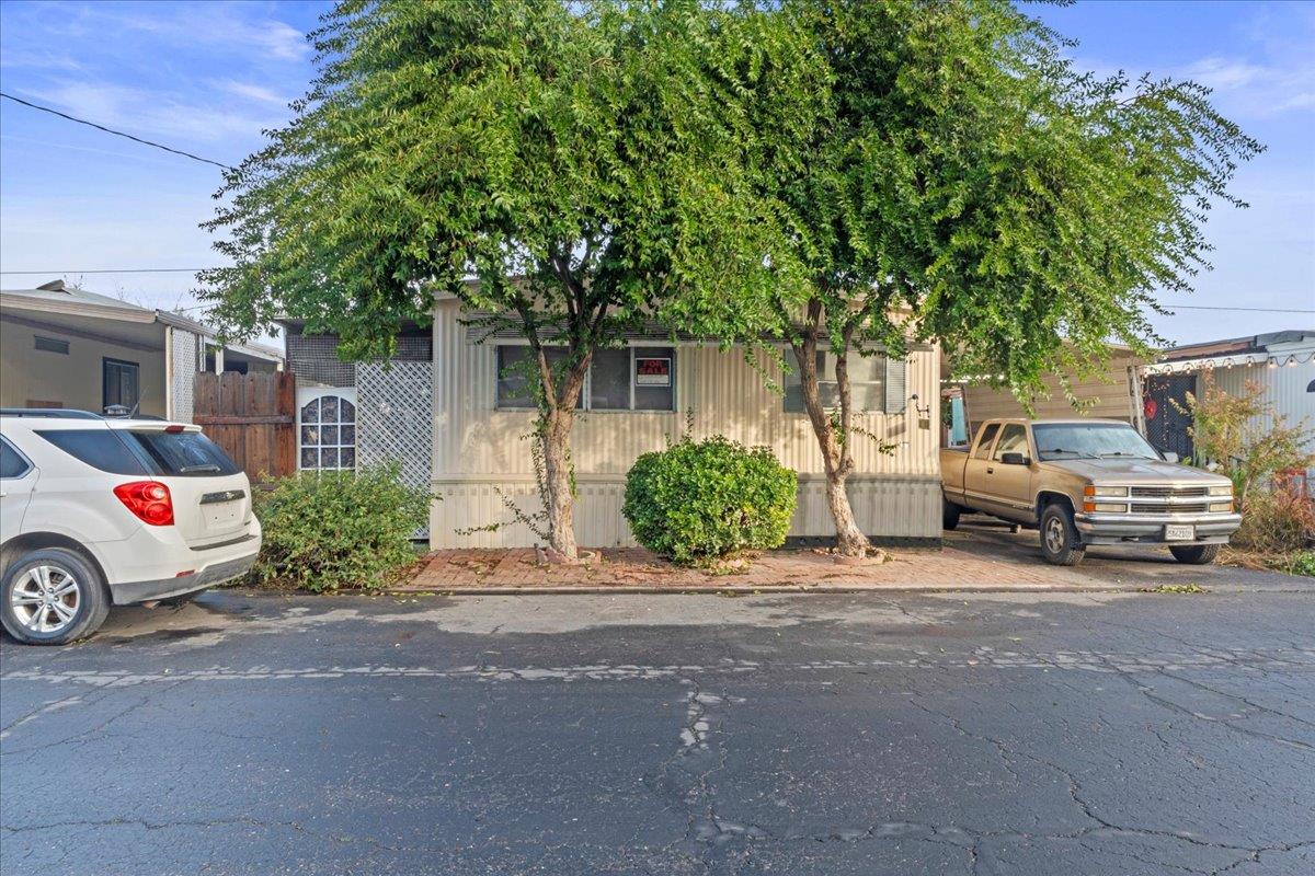 1253 Magic Sands Way Turlock, CA 95380 - Photo 3 of 5 a car parked in front of a house
