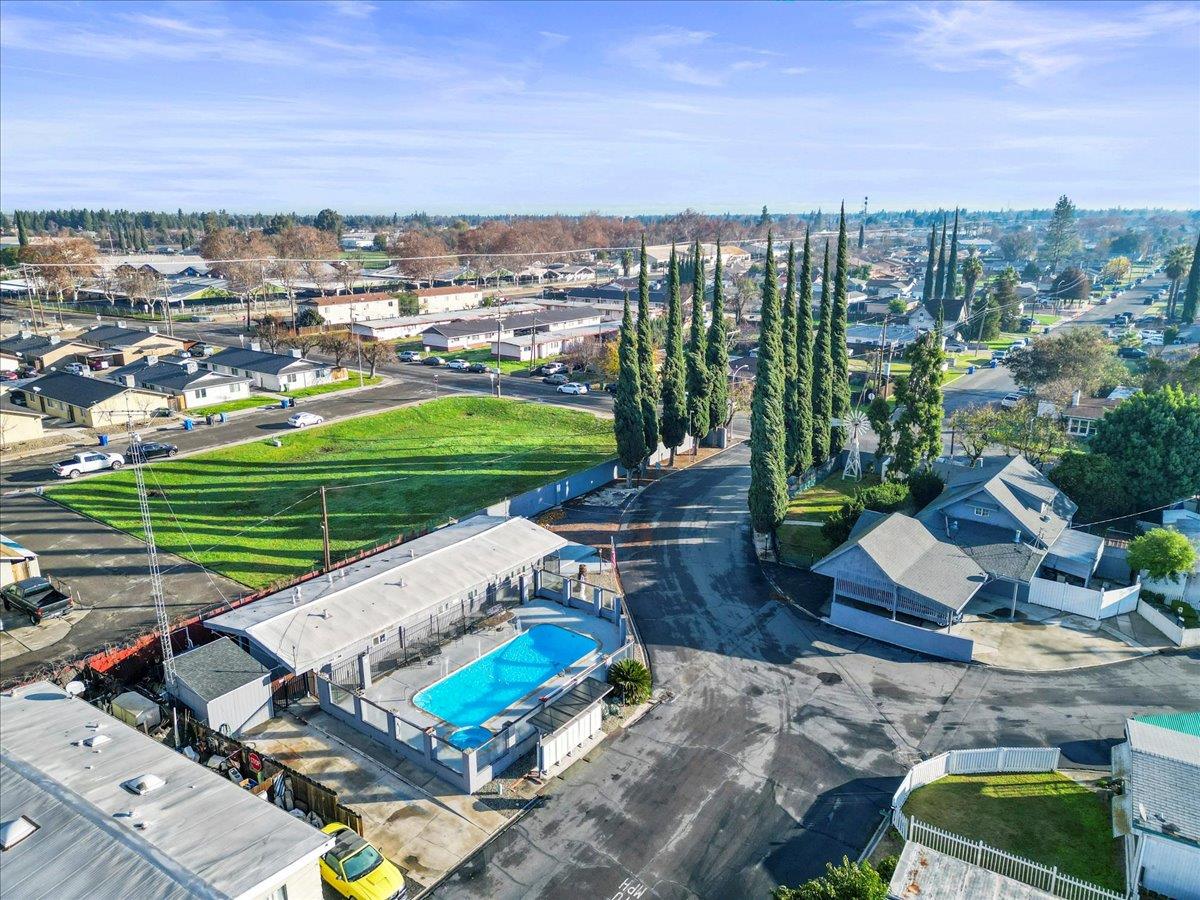 1253 Magic Sands Way Turlock, CA 95380 - Photo 4 of 5 an aerial view of a house with a garden and lake view