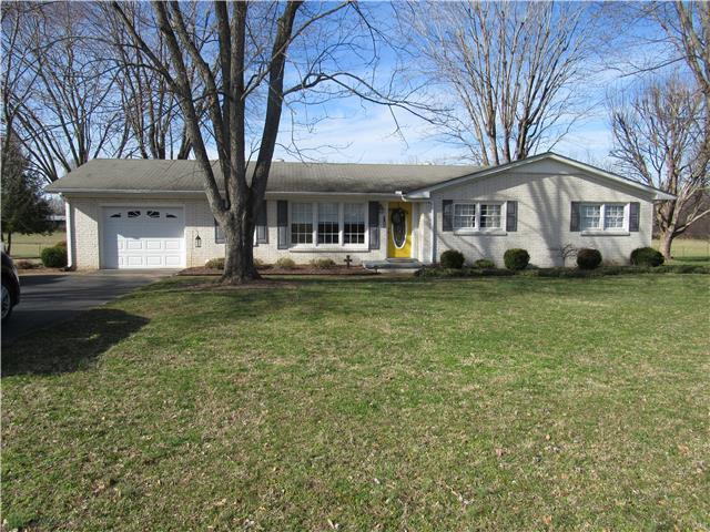 1801 Ann Road Lawrenceburg, TN 38464 - Photo 1 of 10 a big white house with a big yard and large trees