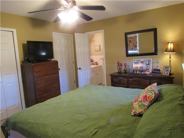 1801 Ann Road Lawrenceburg, TN 38464 - Photo 6 of 10 a bedroom with a bed and flat screen tv