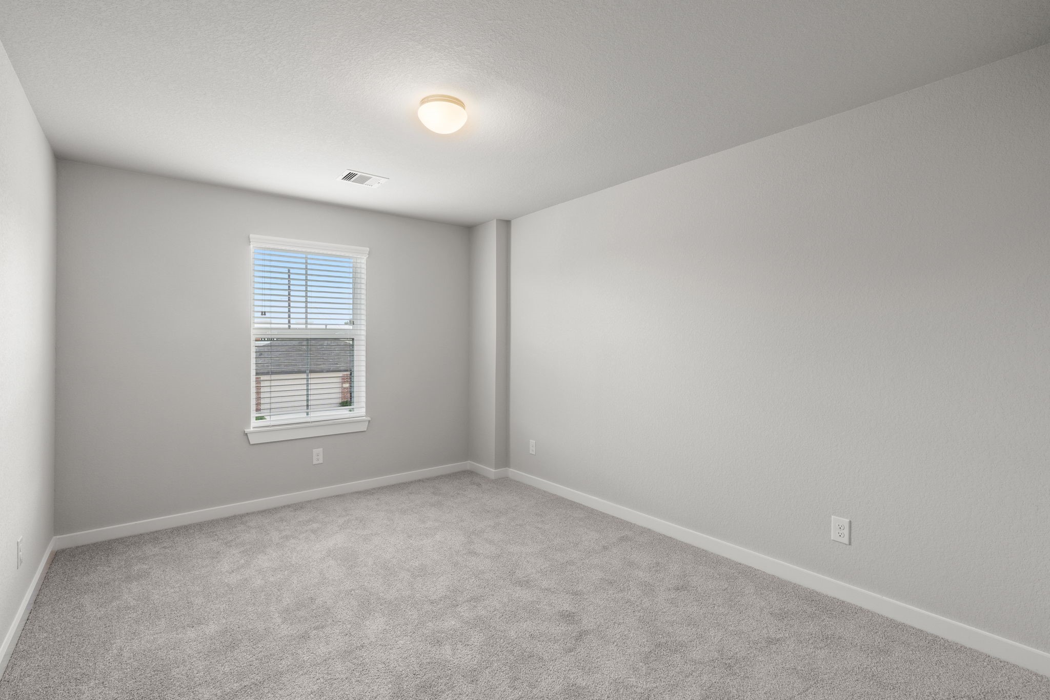15207 Statice Trail Houston, TX 77044 - Photo 21 of 24 a view of an empty room with a window