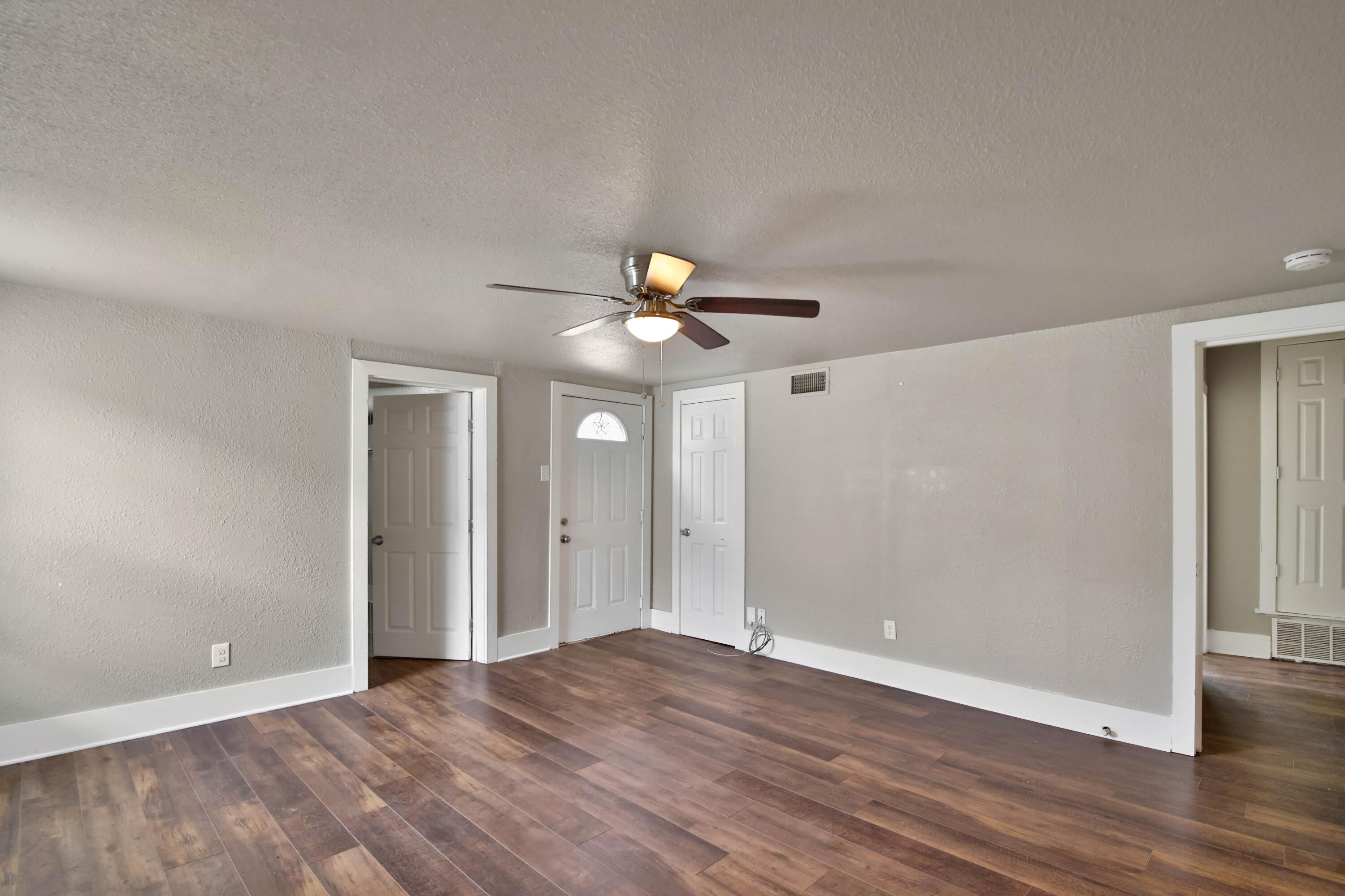 2408 24th Street Lubbock, TX 79411 - Photo 15 of 32 a view of empty room with wooden floor
