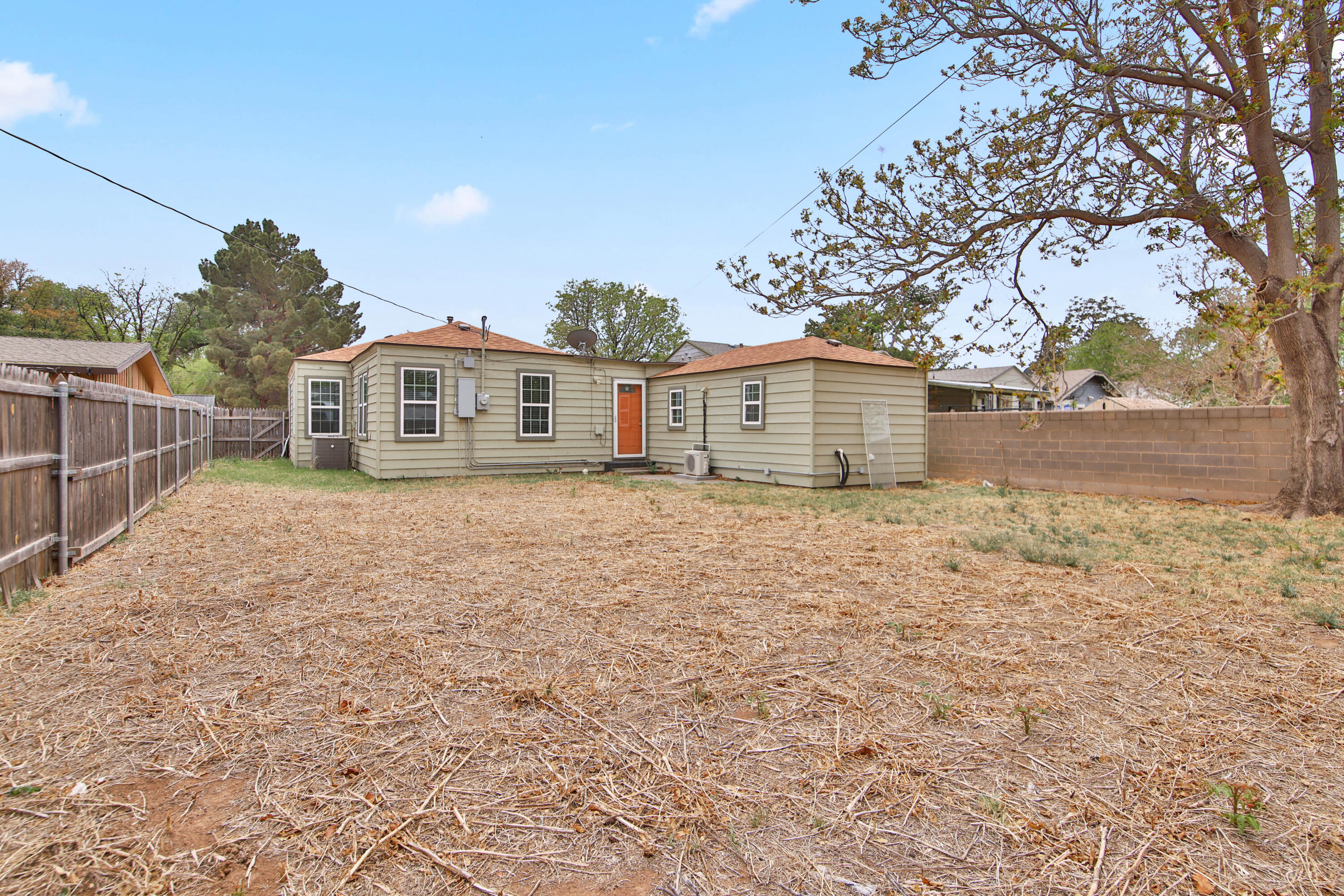2408 24th Street Lubbock, TX 79411 - Photo 29 of 32 a front view of a house with a yard