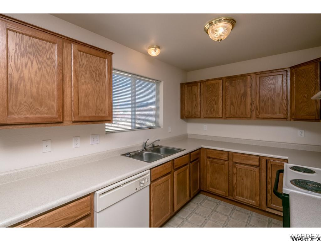 3620 Bosque Road Golden Valley, AZ 86413 - Photo 22 of 35 a kitchen with a sink and cabinets