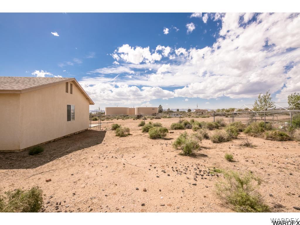 3620 Bosque Road Golden Valley, AZ 86413 - Photo 26 of 35 a view of a house with a snow