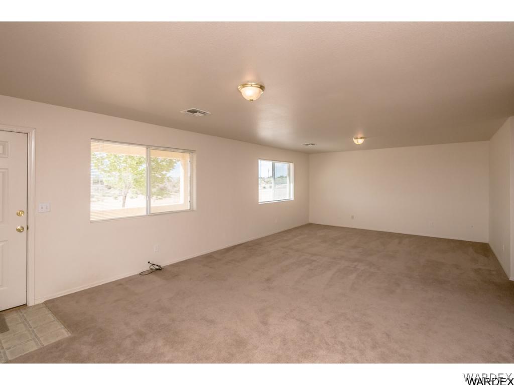 3620 Bosque Road Golden Valley, AZ 86413 - Photo 3 of 35 a view of an empty room and a window