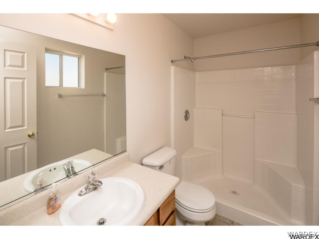 3620 Bosque Road Golden Valley, AZ 86413 - Photo 6 of 35 a bathroom with a sink and a toilet