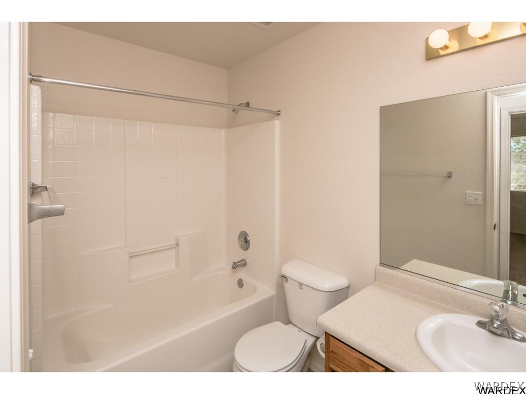 3620 Bosque Road Golden Valley, AZ 86413 - Photo 8 of 35 a bathroom with a sink toilet and shower