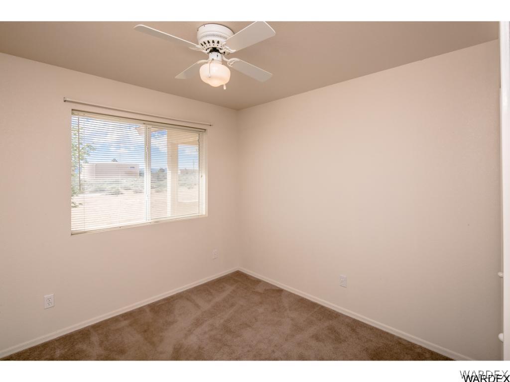3620 Bosque Road Golden Valley, AZ 86413 - Photo 9 of 35 an empty room with a window